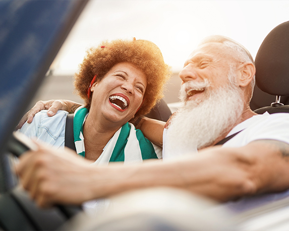 happy senior couple driving in convertible will you have enough to retire